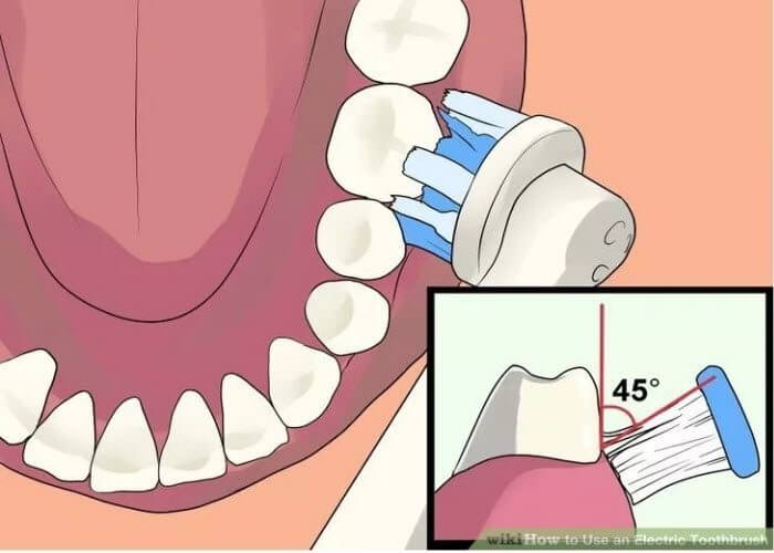 Як чистити зуби електричною зубною щіткою