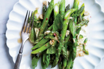Warm salad from asparagus, walnuts and arugula - dietary recipe for New year's table