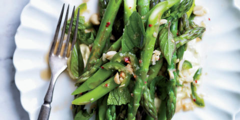 Warm salad from asparagus, walnuts and arugula - dietary recipe for New year's table